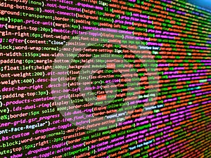 Web developer HTML code with CSS on screen. Template of website, selective focus. Big data storage and cloud computing