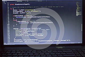 Web developer PHP code close up. Charging customer using Stripe API. Online payments processing