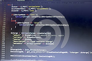 Web developer PHP code close up. Charging customer using Stripe API. Online payments processing
