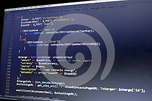 Web developer PHP code close up. Charging customer using Stripe API. Online payments processing