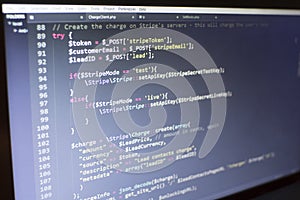 Web developer PHP code close up. Charging customer using Stripe API. Online payments processing