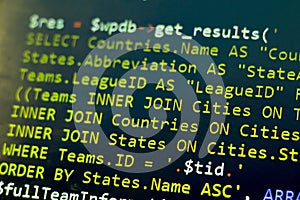 Web developer PHP code close up. Macro shot of complicated SQL query to database