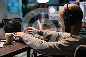 Web developer with physical disability writing code