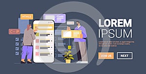 web developers couple creating program code on smartphone screen development of software and programming