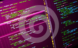 Web developing of the site using php language. Php coding on violet background, close up