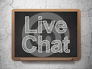 Web development concept: Live Chat on chalkboard background