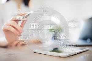 Web development tools concept on virtual screen. Programming language and scripts. PHP, SQL, HTML, Java and others.