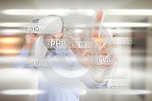 Web development tools concept on virtual screen. Programming language and scripts. PHP, SQL, HTML, Java and others.
