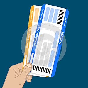hand holding two boarding passes