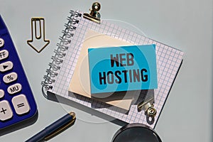Web hosting business text concept. Text in notebook on table.