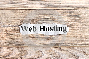 web hosting text on paper. Word web hosting on torn paper. Concept Image