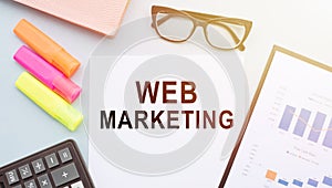 Web Marketing - text on notebook in office table. Business Concept