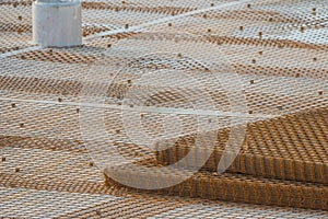 Web of metal rebar or armature steel seen on a construction site, big concrete plate is about to be made, steel rebar for support