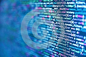 Web site codes on computer monitor. Creative Js HTML5 closeup set on background. Abstract computer script source code. Digital