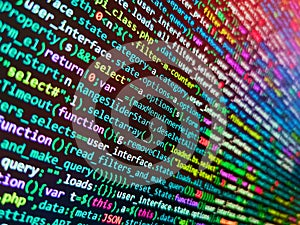 Web site codes on computer monitor. Developer working on program codes in office. Blurred screen with selective focus. Internet