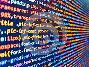 Web site codes on computer monitor. Php code on blue background in code editor. Coding hacker concept. Programmer developer screen