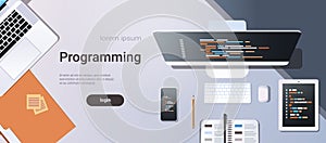Web site design development program code programming concept top angle view desktop computer monitor tablet smartphone