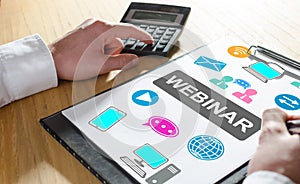 Webinar concept on a clipboard