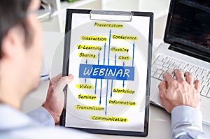 Webinar concept on a clipboard