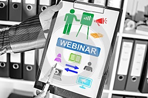 Webinar concept on a clipboard