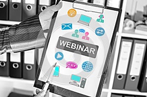 Webinar concept on a clipboard