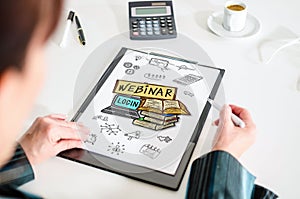 Webinar concept on a clipboard