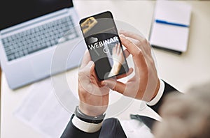 Webinar concept, online training. man holding a smartphone