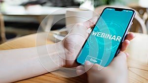 Webinar E-learning Online Training Coaching Education concept on mobile phone screen.