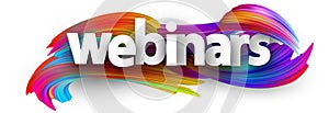 Webinars paper sign over brush strokes background