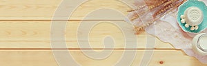 Website banner of dairy products and fruits on wooden background. Symbols of jewish holiday - Shavuot