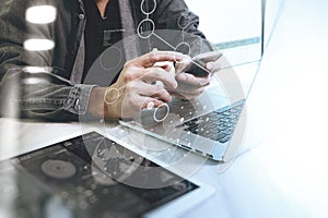 Website designer working digital tablet and computer laptop wit