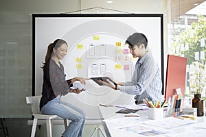 Website developer team brainstorming and discussing for mobile application software design project together.