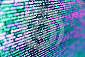 Website development. Developer working on program codes in office. Front-end applications in the color concept. Computer