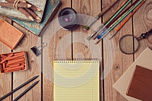 Website header design with notebook page and creative vintage objects.