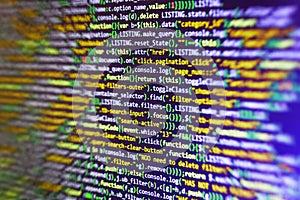 Website HTML Code on the Laptop Display Closeup Photo. Javascript functions, variables, objects.