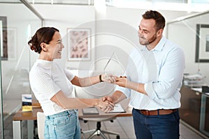 Wed love to commend you on your services. a businesswoman giving her partner an award.