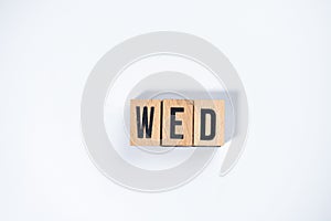 ` WED ` text made of wooden cube on  White background