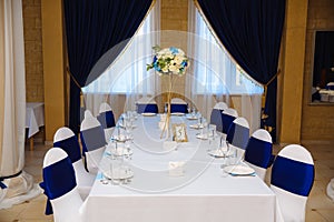 Wedding accessories. The decoration of the Banquet Hall. Table newlyweds