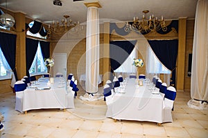 Wedding accessories. The decoration of the Banquet Hall. Table newlyweds