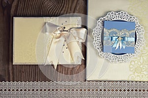 Wedding accessories and invitations to frame light wooden table