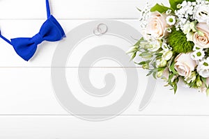 Wedding accessories on white wooden table