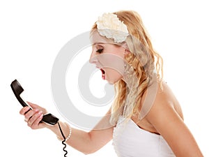 Wedding. Angry woman fury bride talking on phone