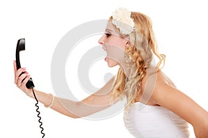 Wedding. Angry woman fury bride talking on phone