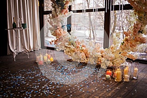 Wedding Arch With Artificial Flowers And Candles