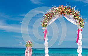 Wedding arch, cabana, gazebo on tropical beach