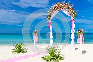 Wedding arch, cabana, gazebo on tropical beach