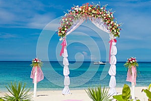 Wedding arch, cabana, gazebo on tropical beach