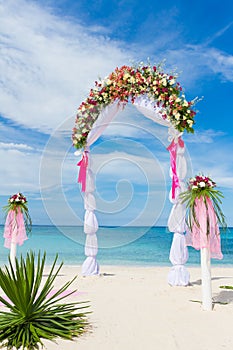 Wedding arch, cabana, gazebo on tropical beach