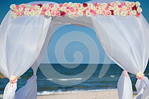 Wedding arch for ceremony on background of sea