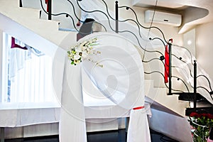 Wedding arch with decor flowers indoor restaurant.